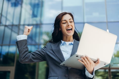 Businesswoman celebrating achievement