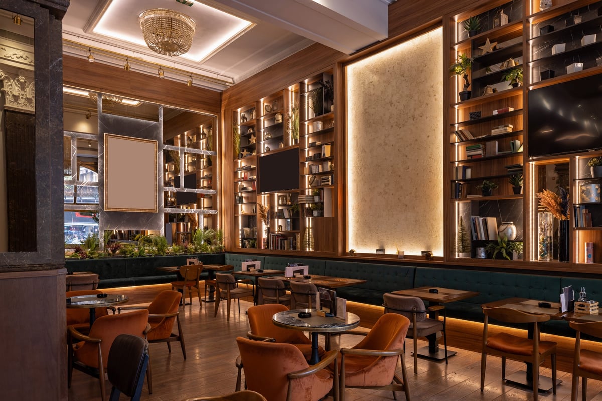 Stylish double-level restaurant with wooden décor and warm ambient lighting