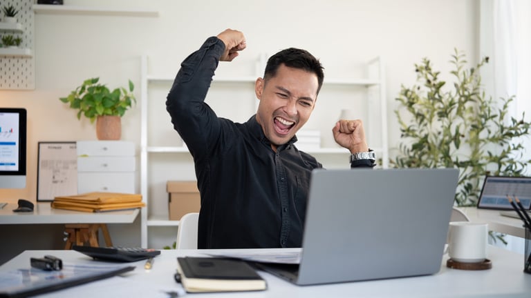 Excited businessman celebrating success