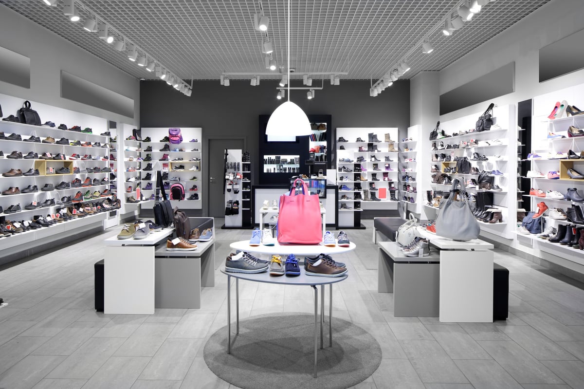 Fashionable shoe store interior in modern mall